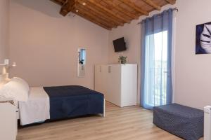 Postel nebo postele na pokoji v ubytování Podere n.8 Bio Casale Maremma