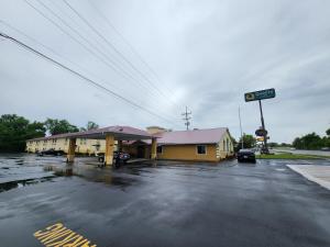 a flooded parking lot in front of a gas station at Quality Inn Wheelersburg in Wheelersburg