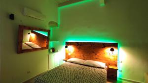 Ένα ή περισσότερα κρεβάτια σε δωμάτιο στο B&B Santa Rita Corato