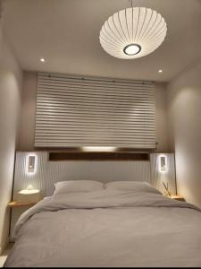 Krevet ili kreveti u jedinici u objektu Koon Terrace Stay