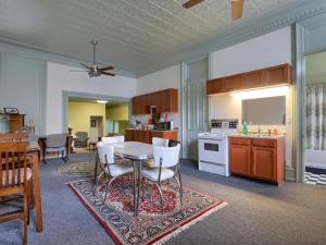 a kitchen with a table and chairs in a room at Shamokin Bed and Breakfast in Shamokin