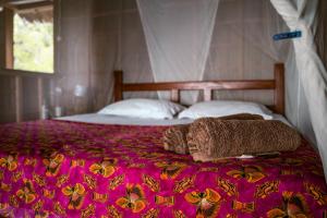 Ein Bett oder Betten in einem Zimmer der Unterkunft Methos Homestay - Raja Ampat