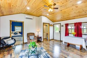 a living room with a wooden ceiling at Northeast Texas Vacation Rental about 6 Mi to Commerce in Commerce
