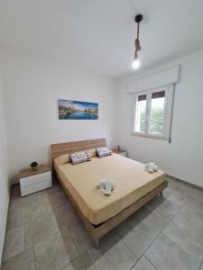 Postel nebo postele na pokoji v ubytování Appartamenti Mirante