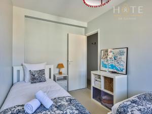 Katil atau katil-katil dalam bilik di Appartement quartier des présidents - vue mer