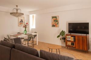 a living room with a couch and a table at Sketches of Milna in Milna