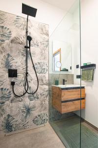 a bathroom with a shower and a sink at MK Appartements in Bad Abbach