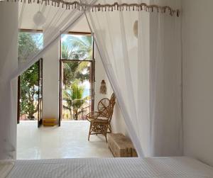 Katil atau katil-katil dalam bilik di Pala Beach Villa