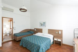 Postel nebo postele na pokoji v ubytování Hotel Giamaika + 37 fotografií
