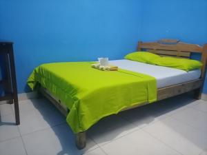 Säng eller sängar i ett rum på Hospedaje Mirador Grecia