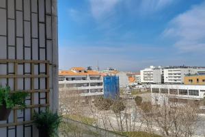 a view of a city from a building at Mar Doce Lar- Entre Mar e Ria in Gafanha da Nazaré