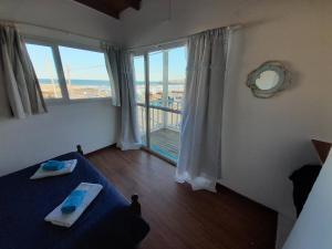 Ένα ή περισσότερα κρεβάτια σε δωμάτιο στο El Atardecer