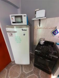 Η κουζίνα ή μικρή κουζίνα στο El Atardecer +5 φωτογραφίες