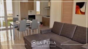 Posezení v ubytování Residence La Perla