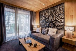 a living room with a couch and a table at Kashmir Wellness & SPA Hotel Adults Only in Velingrad +77 photos