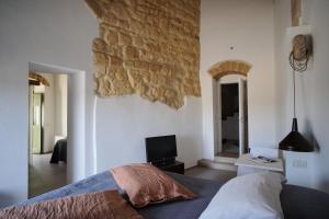 Postel nebo postele na pokoji v ubytování Il Carrubo residenza Walk&Stay + 28 fotografií