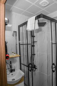 a bathroom with a shower and a sink at Asitane Life Hotel in Istanbul