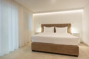 En eller flere senger på et rom på Nono Ban Hotel & Villa