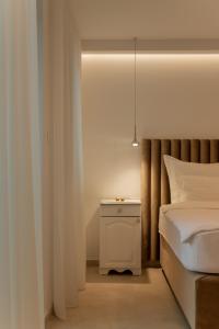 En eller flere senger på et rom på Nono Ban Hotel & Villa