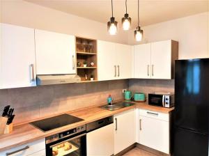 Kuchyň nebo kuchyňský kout v ubytování Modernes Apartment mit Balkon