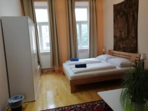 Postel nebo postele na pokoji v ubytování Vienna Comfort Apartments - Borschkegasse 12