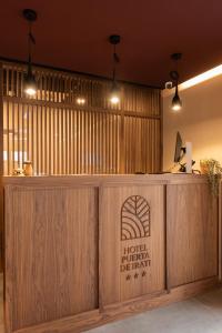a hotel reception desk with a sign on it at Silken Puerta de Irati in Ochagavía +72 photos
