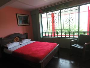 Postel nebo postele na pokoji v ubytování Finca Hotel Guayacundo