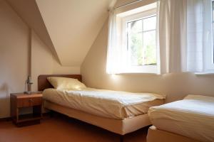 Postel nebo postele na pokoji v ubytování Willa Świerkowa