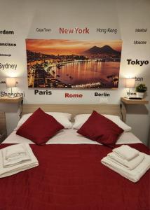 a bedroom with a bed with a poster on the wall at PURGATORIO HOUSE in Naples +179 photos