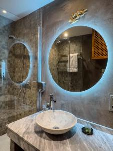 a bathroom with a large sink and a mirror at Almunia de San Miguel in Toledo