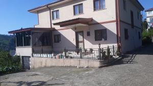 a house with a fence in front of it at Harvel Villa - RESIDENCE FOR FAMILY ONLY - 6 BEDROOMS 