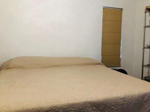 a bedroom with a bed and a closet at Casa la Noria in Parras de la Fuente