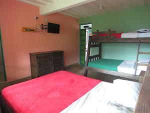 Postel nebo postele na pokoji v ubytování Finca Hotel Guayacundo