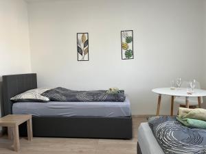 Giường trong phòng chung tại Haus HERZOGENBURG - Ferienwohnungen +28 ảnh