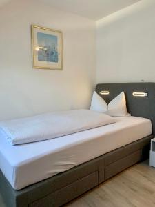 Postel nebo postele na pokoji v ubytování Hotel Wittlicher Hof