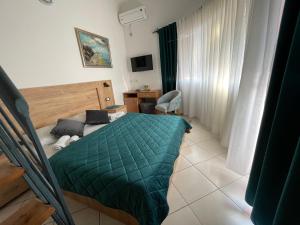 Ένα ή περισσότερα κρεβάτια σε δωμάτιο στο Guest House-MD