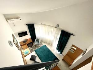 Ένα ή περισσότερα κρεβάτια σε δωμάτιο στο Guest House-MD