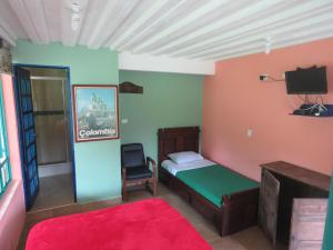 Postel nebo postele na pokoji v ubytování Finca Hotel Guayacundo