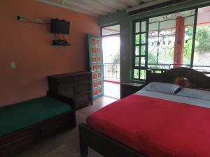Postel nebo postele na pokoji v ubytování Finca Hotel Guayacundo