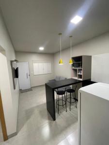 Cuisine ou kitchenette dans l'établissement Vêneto Flat Residence (AP-13)