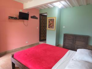 Postel nebo postele na pokoji v ubytování Finca Hotel Guayacundo