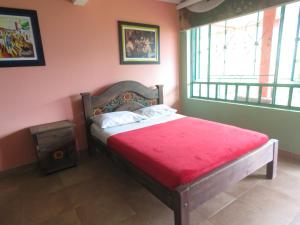 Postel nebo postele na pokoji v ubytování Finca Hotel Guayacundo