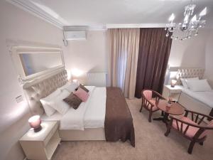 Postel nebo postele na pokoji v ubytování International Inn + 37 fotografií
