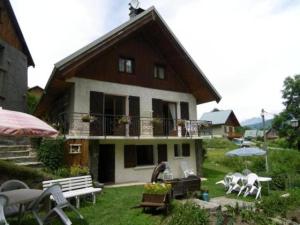 a house with tables and chairs in front of it at Appartement Valloire, 3 pièces, 4 personnes - FR-1-263-158 in Valloire