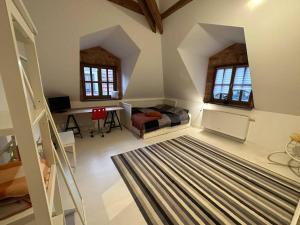 a bedroom with a bed and a desk in a room at Dako Mansion, Stylish, Modern, Cosy in Rzeszów +60 photos