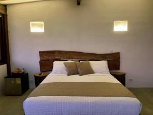 Postel nebo postele na pokoji v ubytování Akela Gaira Hotel