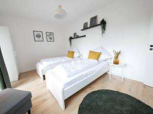 Un pat sau paturi într-o cameră la 69 m², zentral, Balkon, stilvoll
