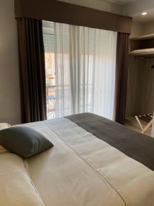 Krevet ili kreveti u jedinici u okviru objekta Netum Hotel