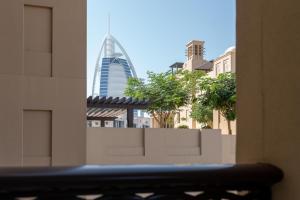 a view of the burj khalifa from a building at Ultimate Stay / Burj Al Arab View / Brand New / Amazing Pool with a View / Perfect Holiday / Madinat Jumeirah / 2 BDR in Dubai