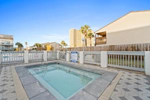 a swimming pool in a yard with a fence at Endless Summer by Panhandle Getaways in Panama City Beach +8 photos